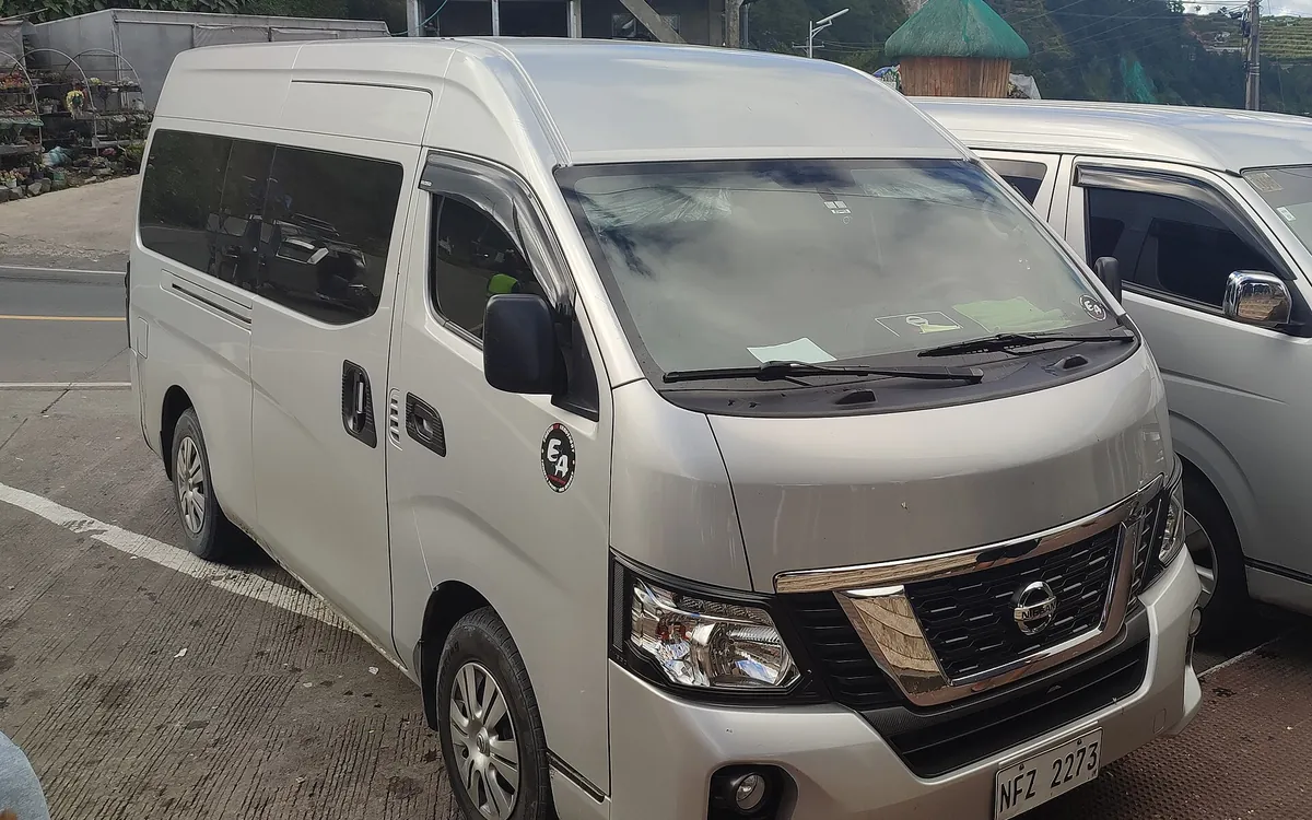 Nissan Urvan-type passenger van for staff transportation